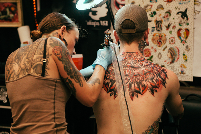 seattle tattoo expo 2016 greenside recreational artist working tattooing back piece american traditional