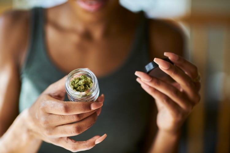 effects of cannabis women holding jar
