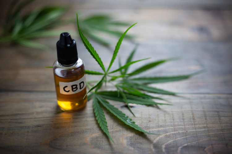 CBD Oil Dose bottle and bud